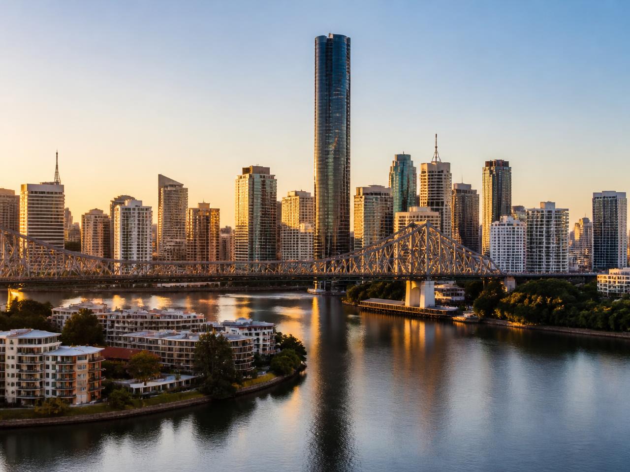 Brisbane city skyline at golden hour with the Brisbane River and Story Bridge